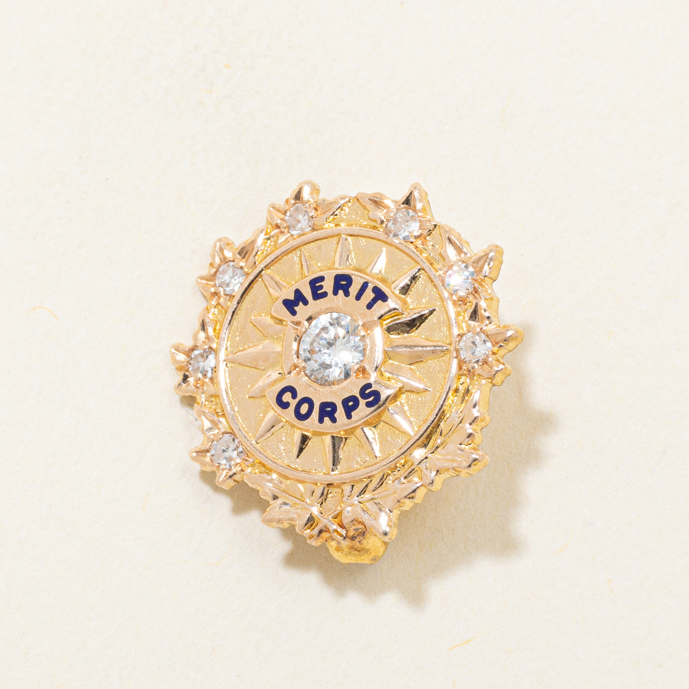 14k Diamond "Merit Corps" Starburst Brooch | 0.14ctw