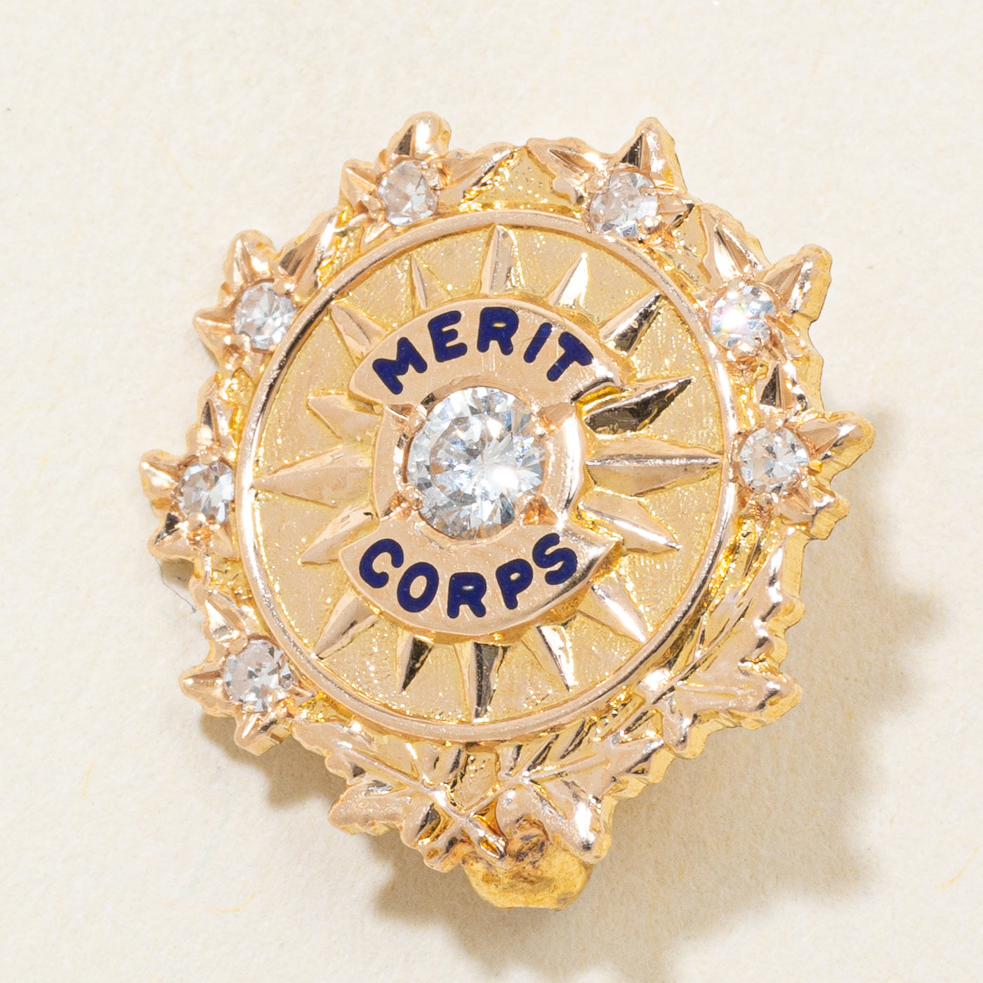 14k Diamond "Merit Corps" Starburst Brooch | 0.14ctw