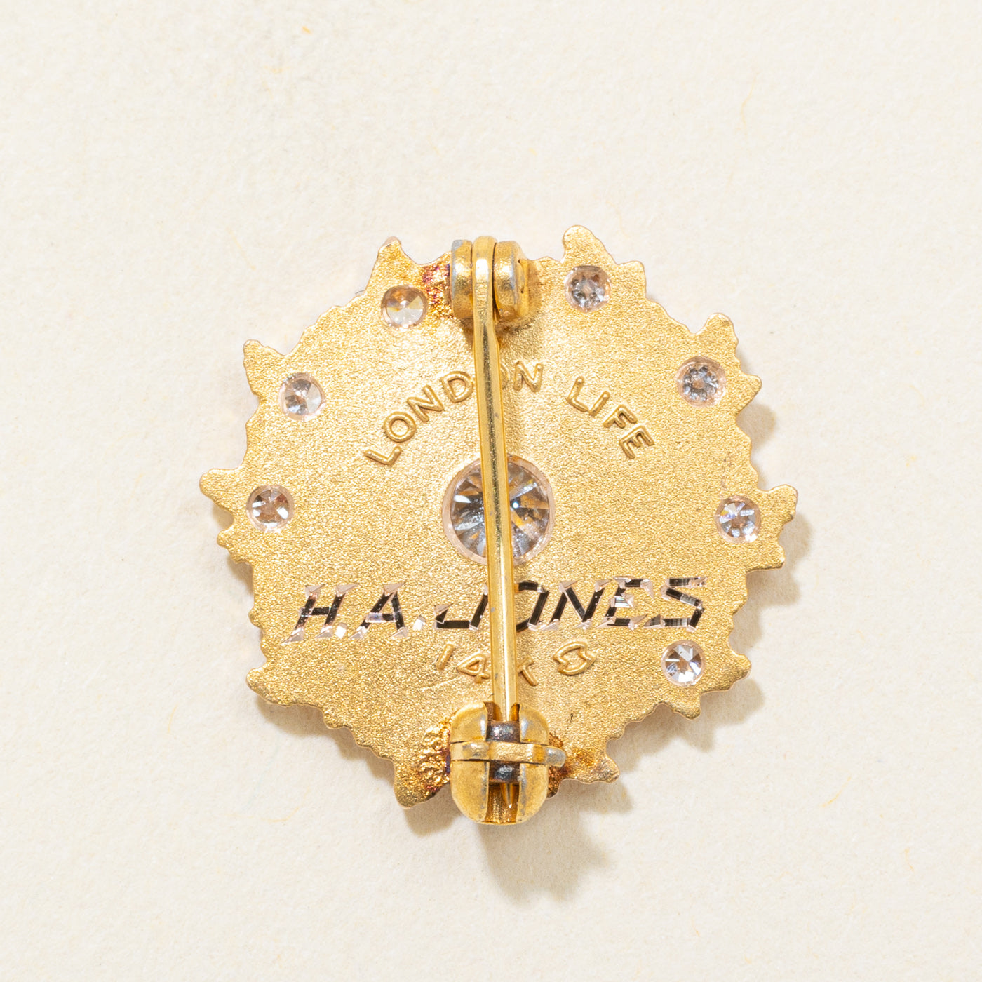 14k Diamond "Merit Corps" Starburst Brooch | 0.14ctw