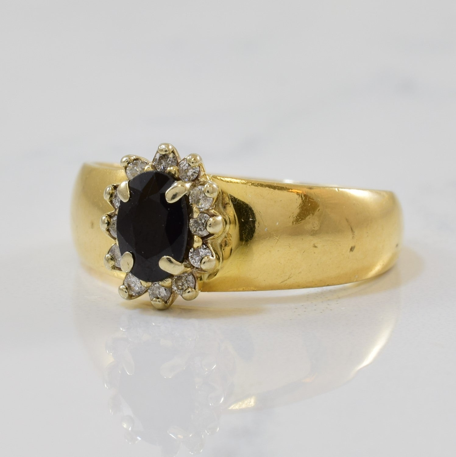 Oval Sapphire & Diamond Halo Ring | 0.60ct, 0.12ctw | SZ 6.5 |