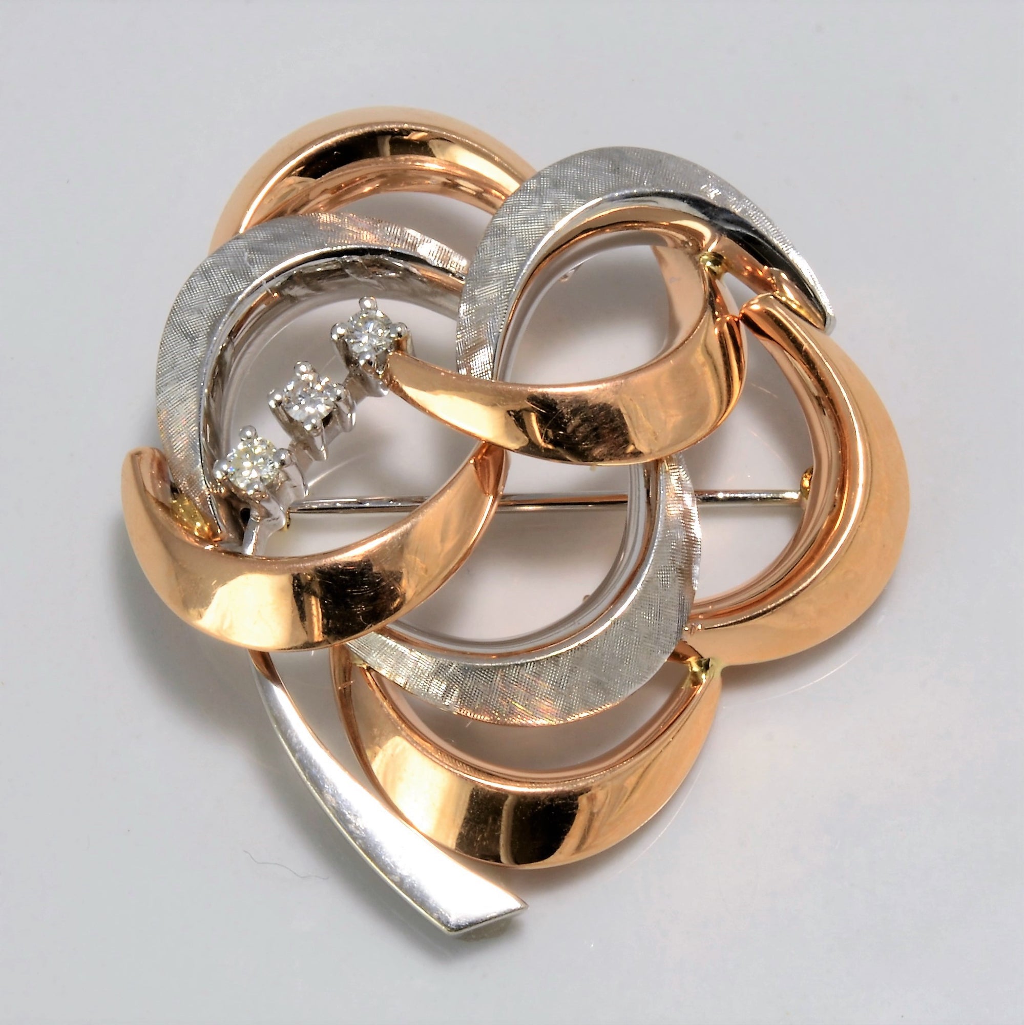 Two Tone Gold Intertwined Diamond Brooch | 0.15 ctw |