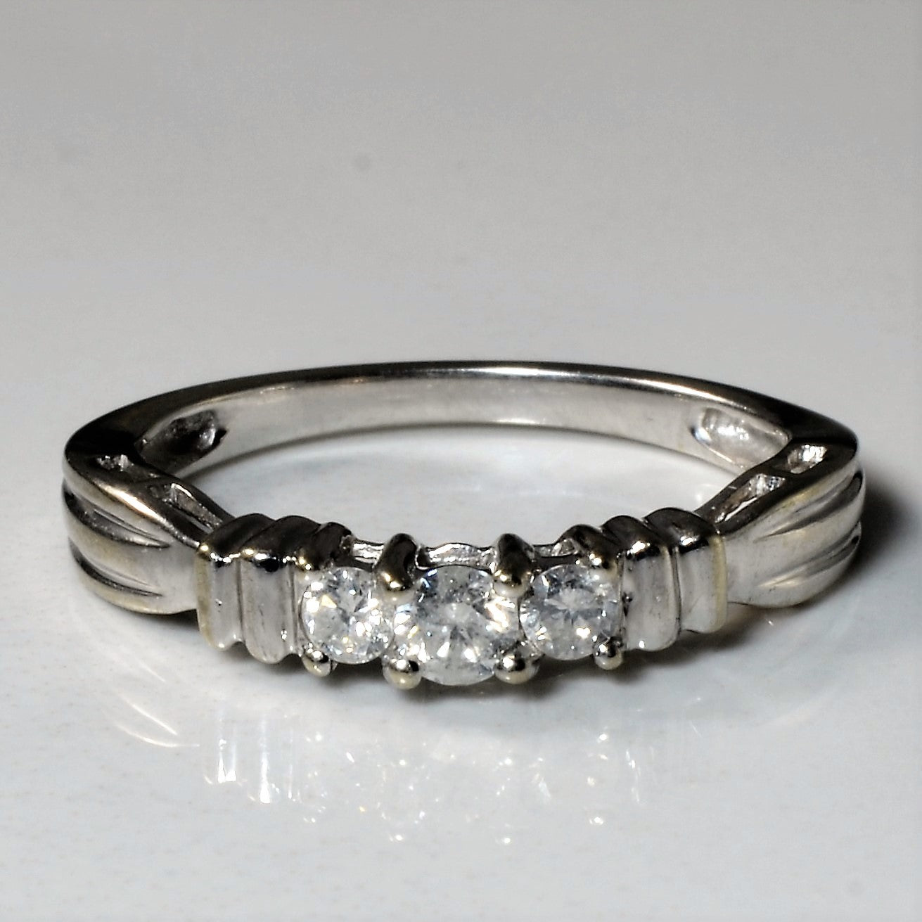 Three Stone Diamond Ring | 0.22ctw | SZ 7 |