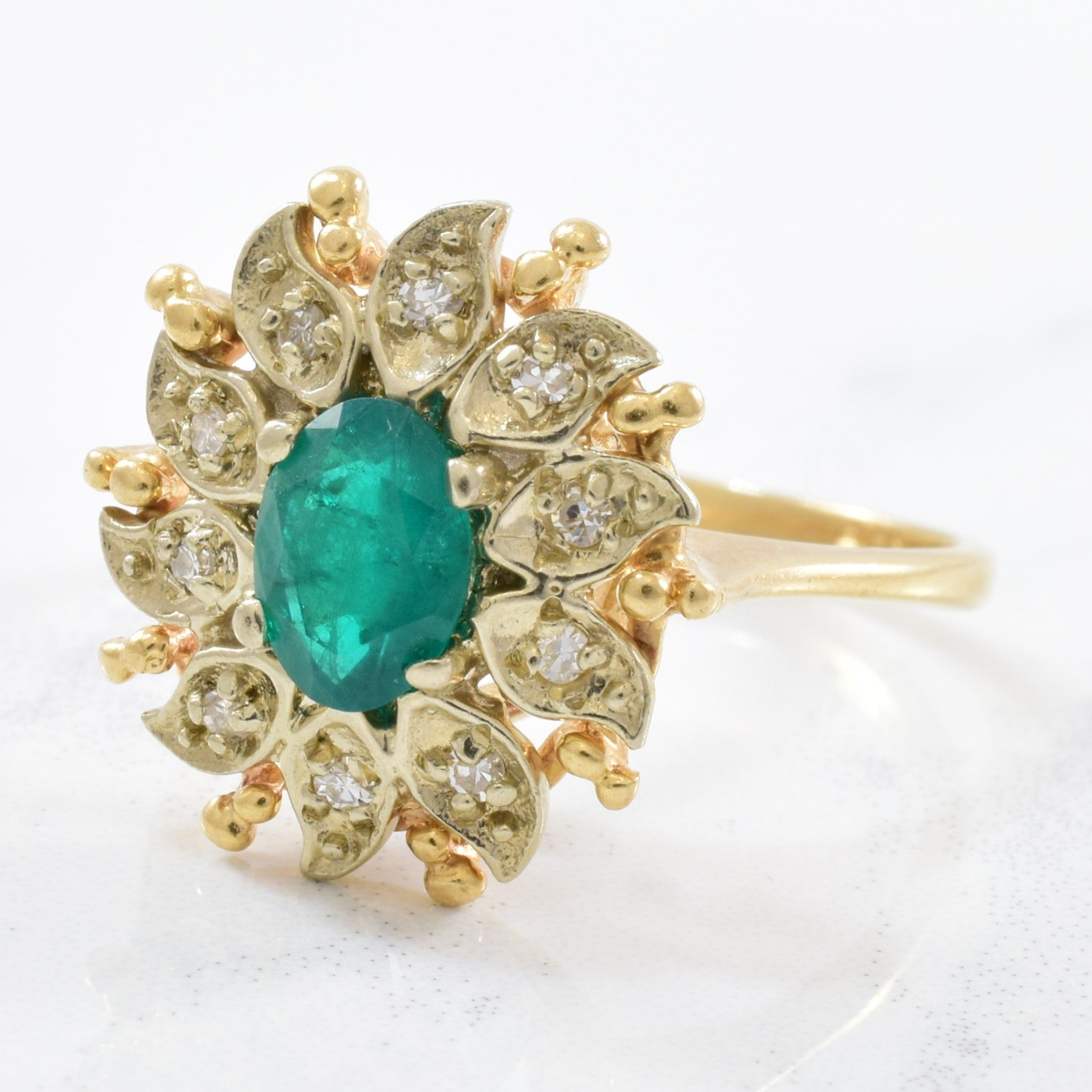 Courtship' Floral Diamond Halo Emerald Ring Circa 1940s | 0.12ctw, 0.55ct | SZ 8 |