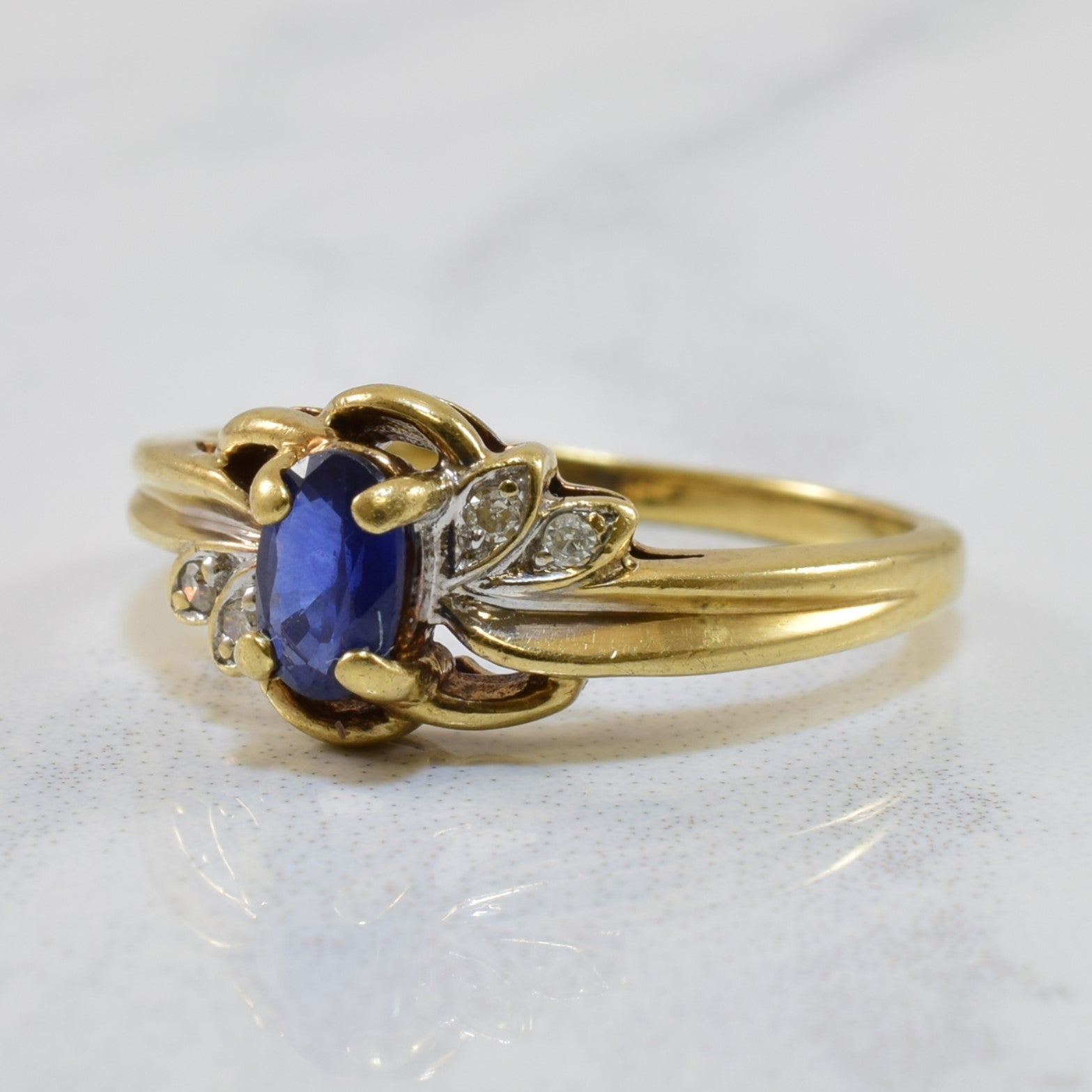 Oval Sapphire & Diamond Bypass Ring | 0.28ct, 0.02ctw | SZ 4 |