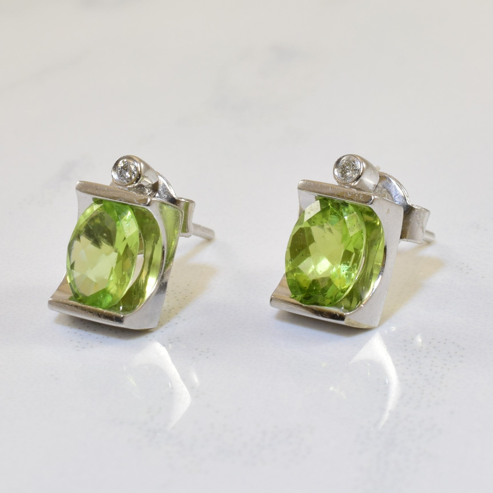 Tension Set Peridot & Diamond Stud Earrings | 1.40ctw, 0.02ctw |