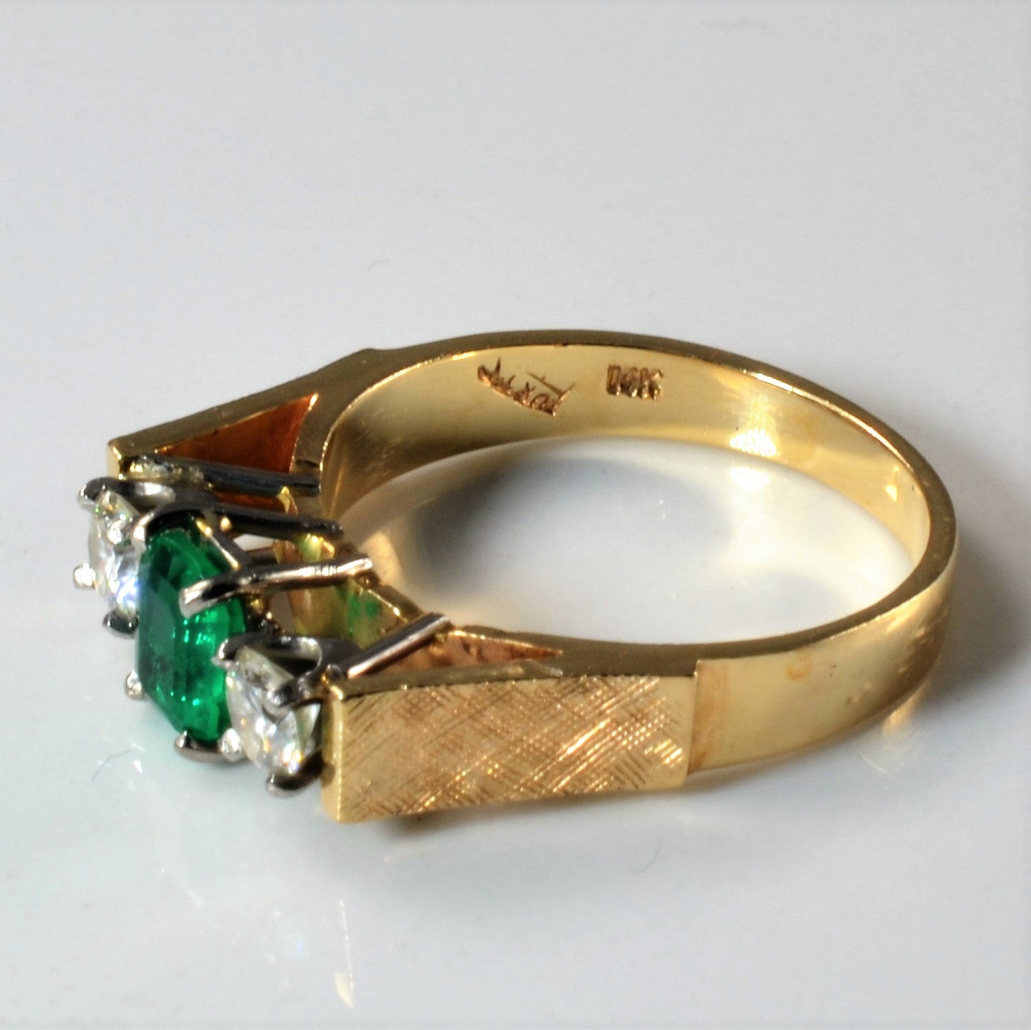 Emerald three stone set emerald and diamond vintage ring