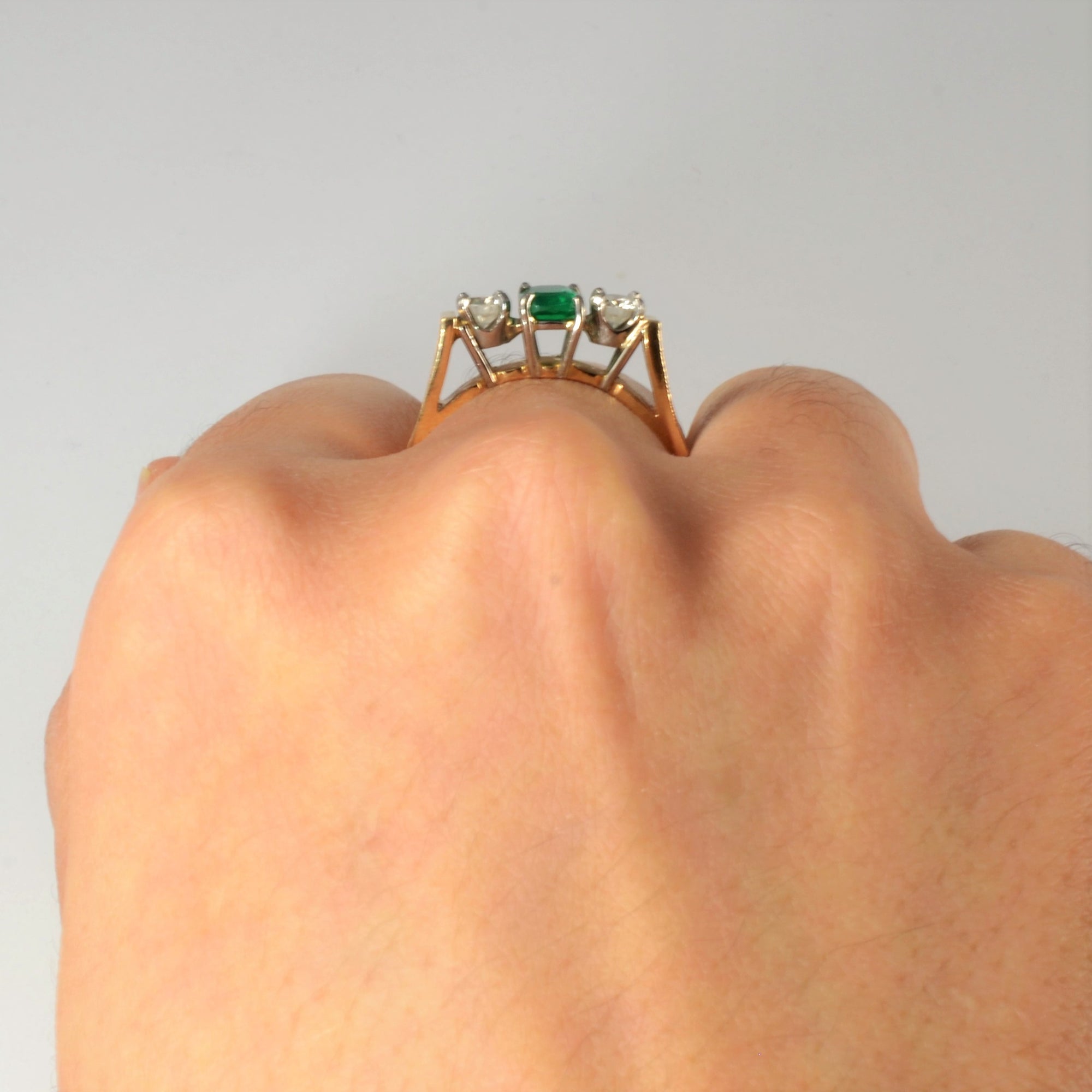 round brilliant cut diamonds with emerald in vintage three stone rings for sale in Canada