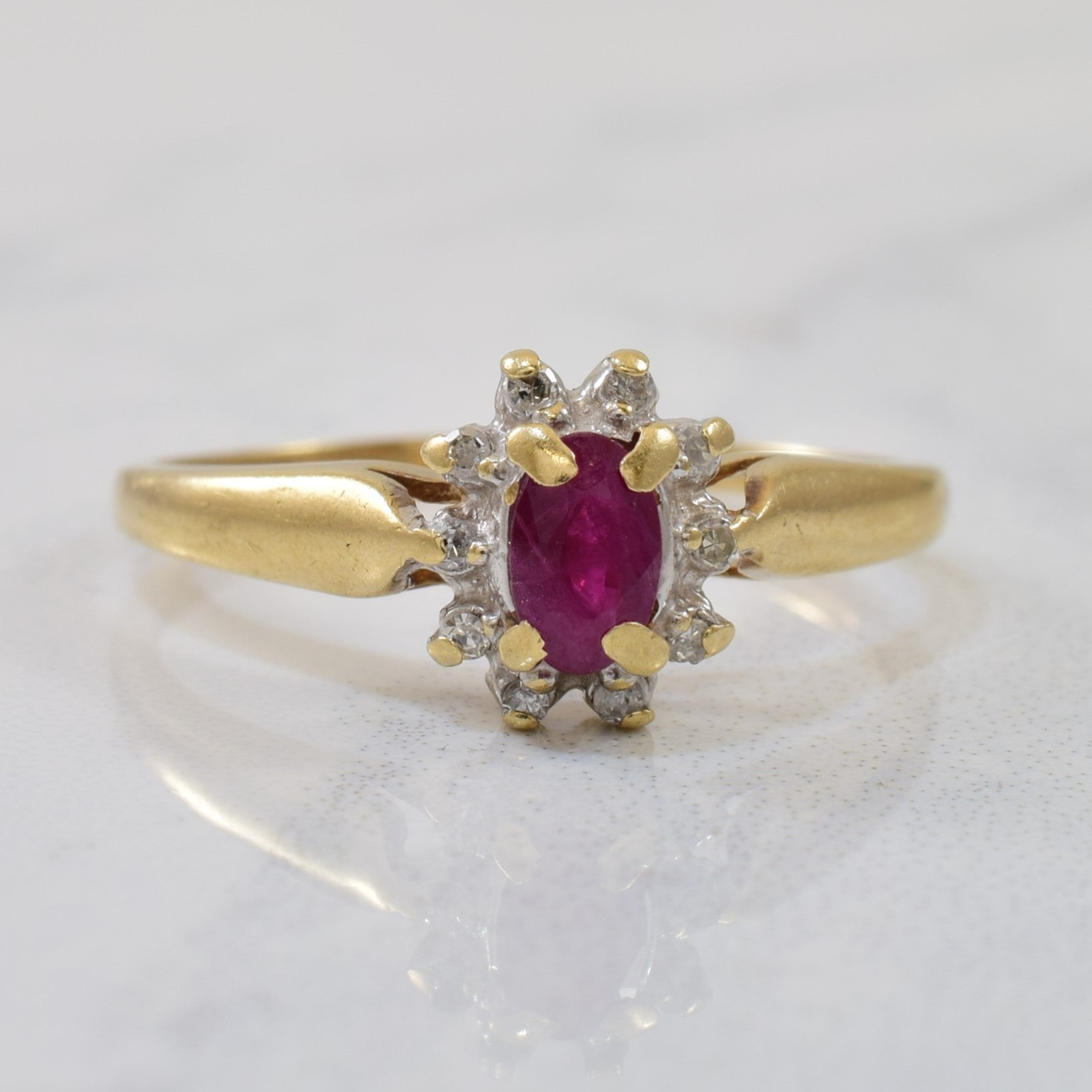 Oval Cut Ruby & Diamond Halo Ring | 0.25ct, 0.05ctw | SZ 6.75 |