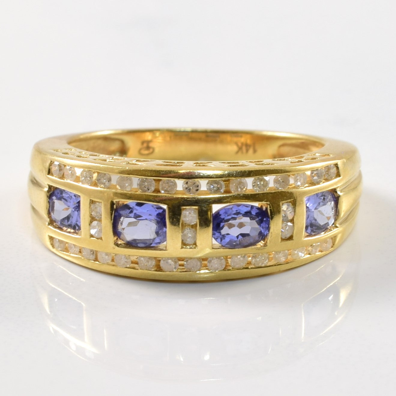 Channel Set Tanzanite & Diamond Ring | 0.68ct, 0.18ctw | SZ 7.75 |