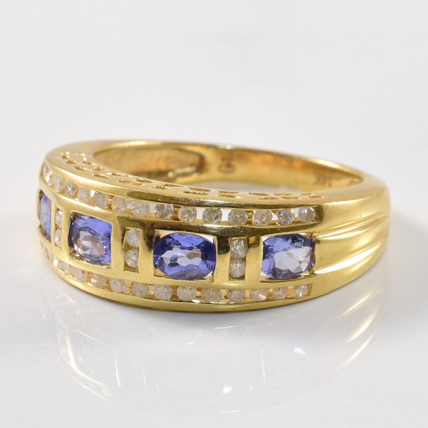 Channel Set Tanzanite & Diamond Ring | 0.68ct, 0.18ctw | SZ 7.75 |