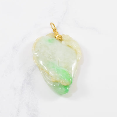 Carved Jadeite Pendant | 80.00 ct |