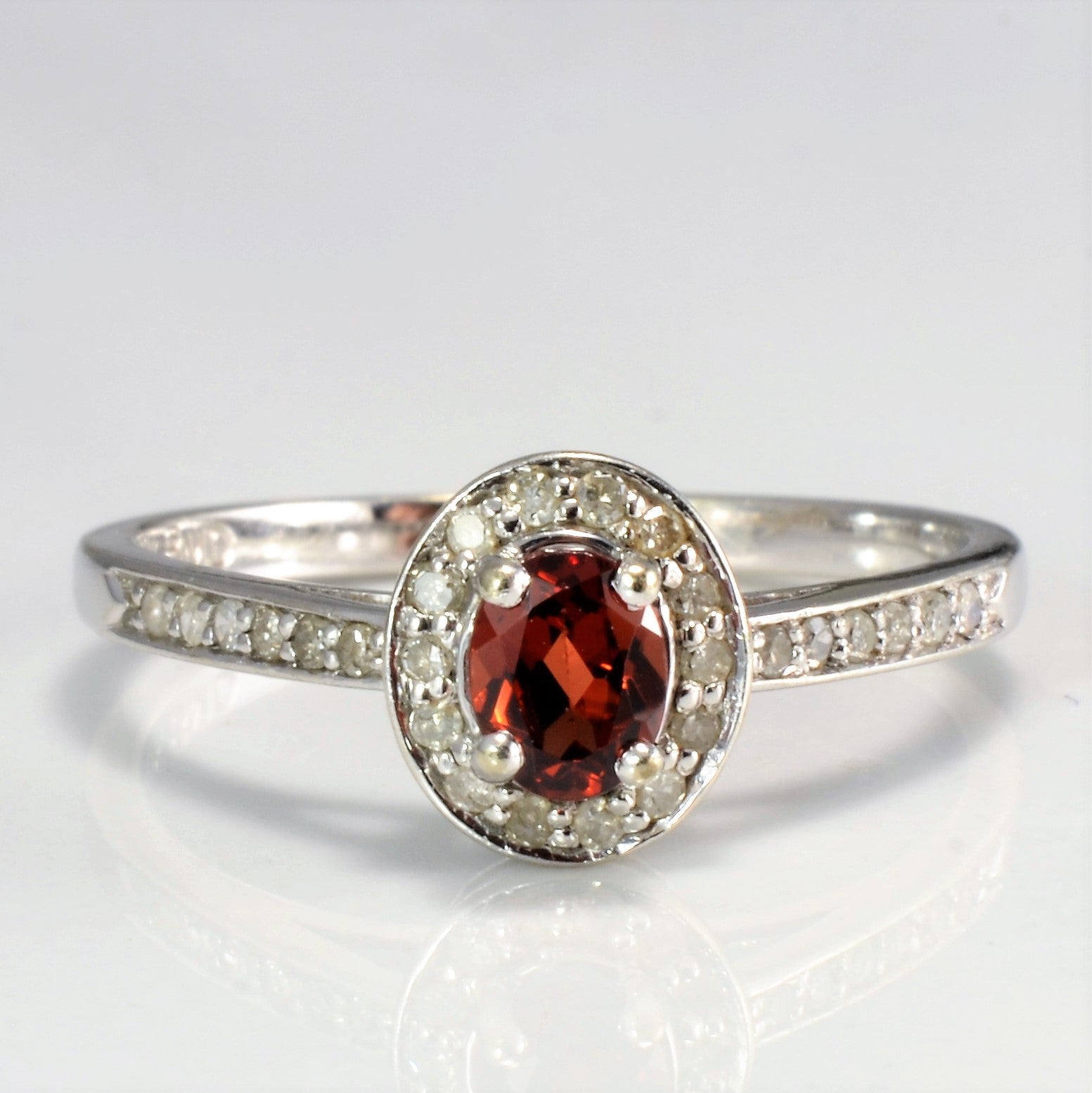 Halo Set Garnet Ring | 0.13 ctw SZ 7 |