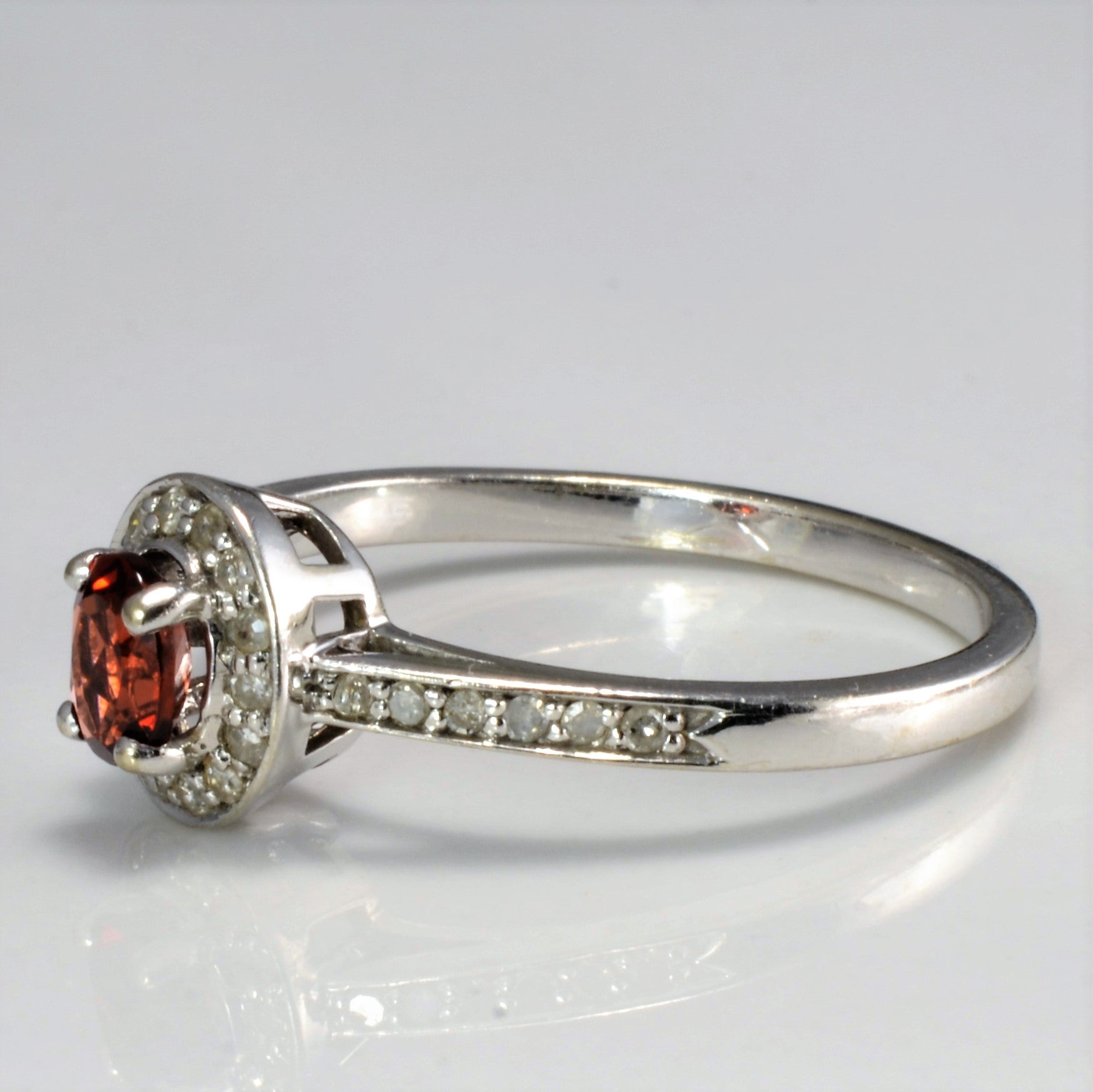 Halo Set Garnet Ring | 0.13 ctw SZ 7 |