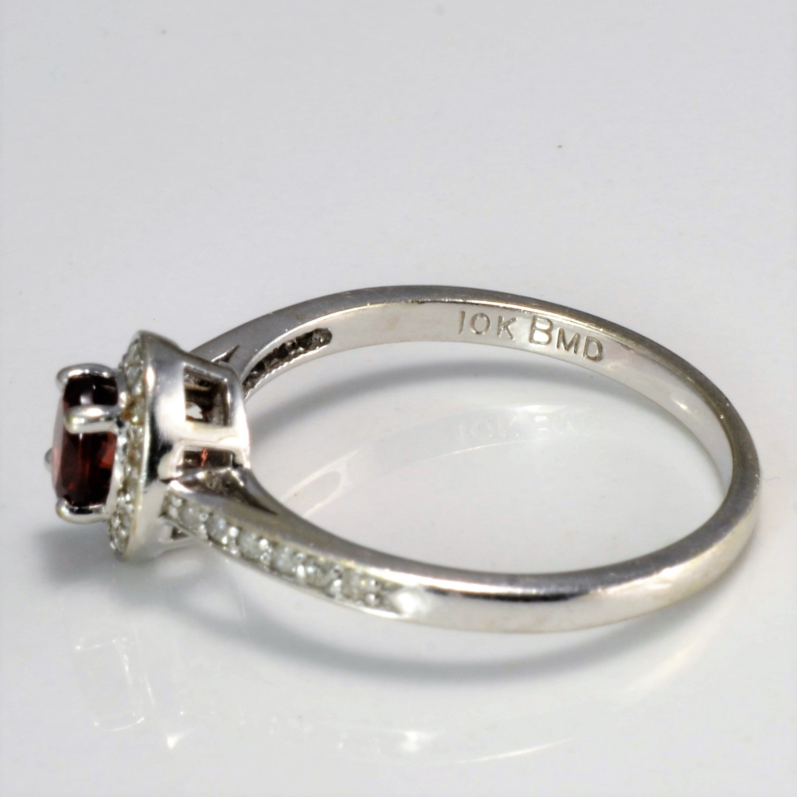 Halo Set Garnet Ring | 0.13 ctw SZ 7 |