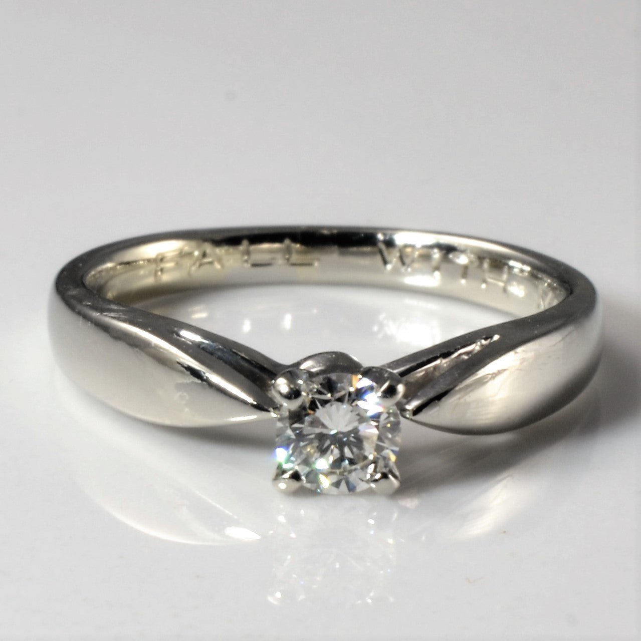 Tapered solitaire round brilliant cut engagement rings for sale in Canada