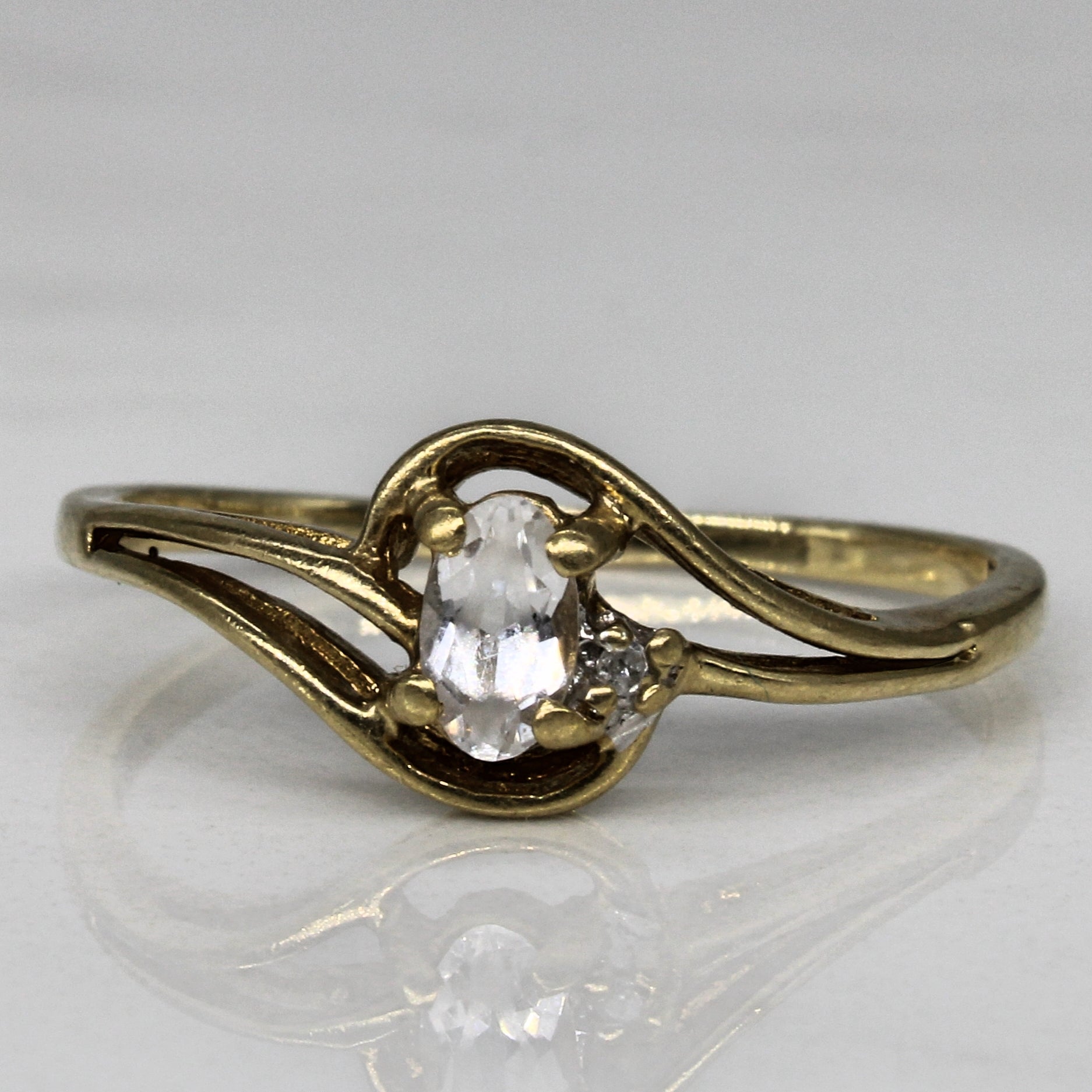 Topaz & Diamond Cross Over Ring | 0.16ct, 0.01ct | SZ 7.25 |
