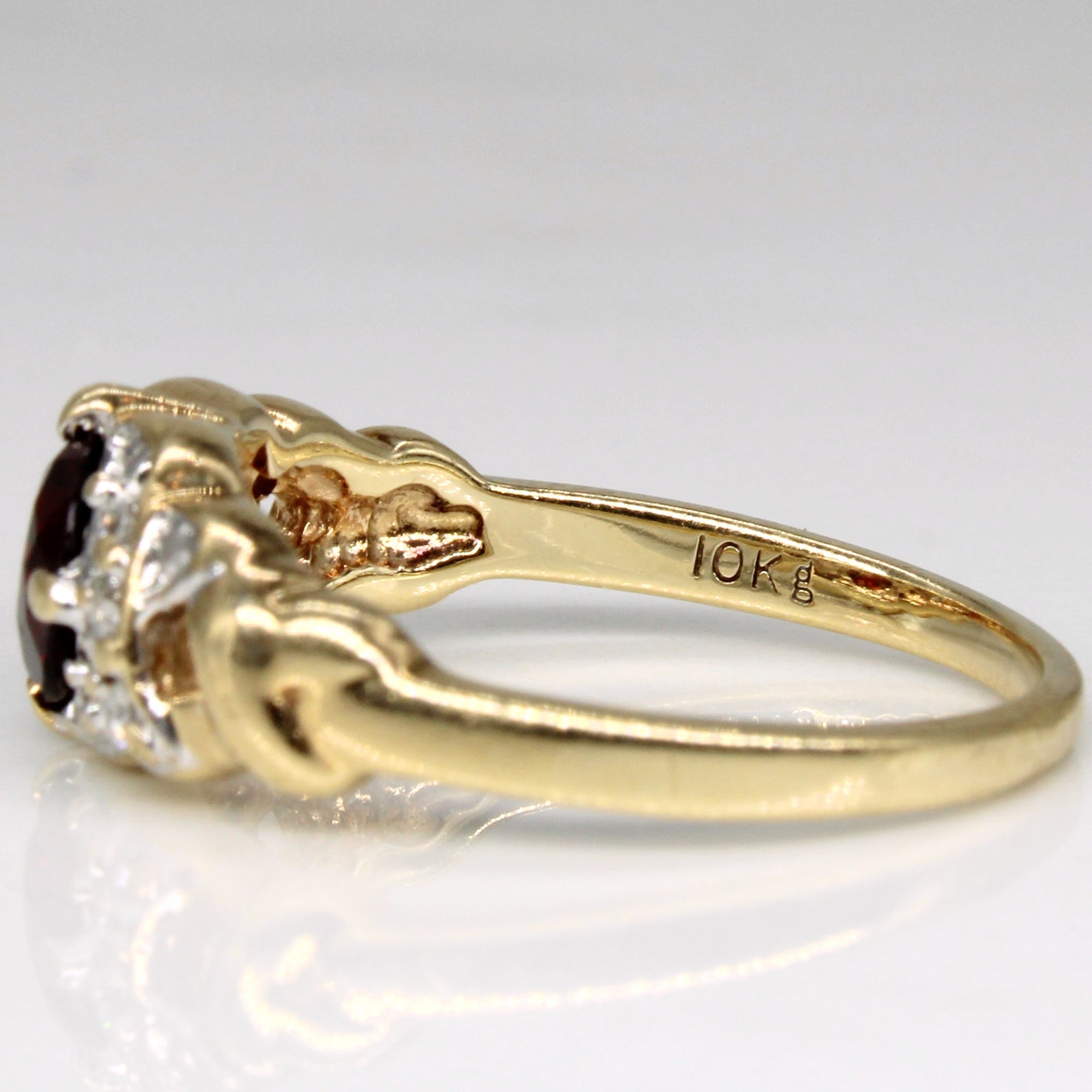 Garnet & Diamond Ring | 0.64ct, 0.08ctw | SZ 6.25 |