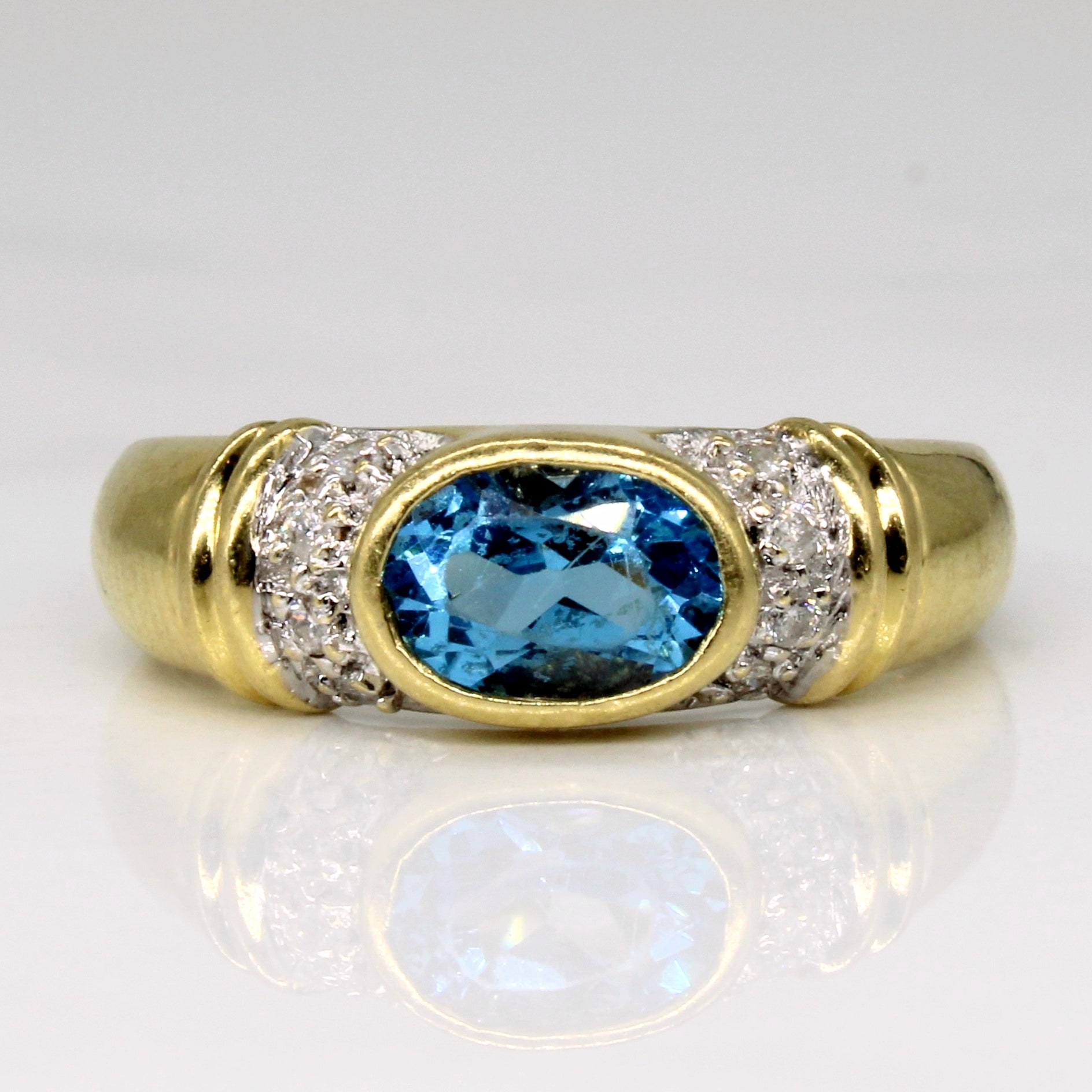 East West Bezel Set Blue Topaz Ring | 0.88ct, 0.06ctw | SZ 6.25 |