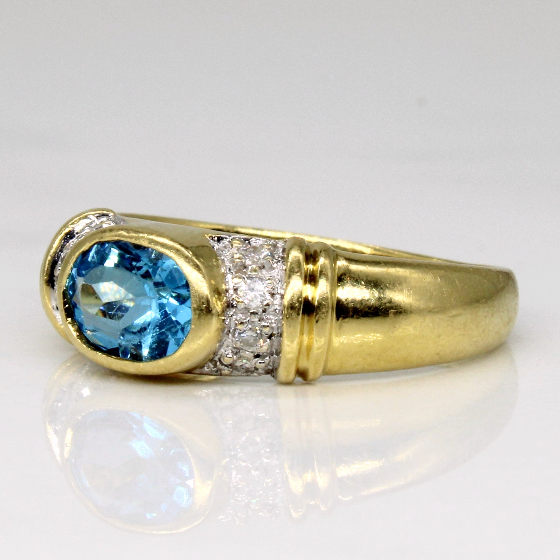 East West Bezel Set Blue Topaz Ring | 0.88ct, 0.06ctw | SZ 6.25 |