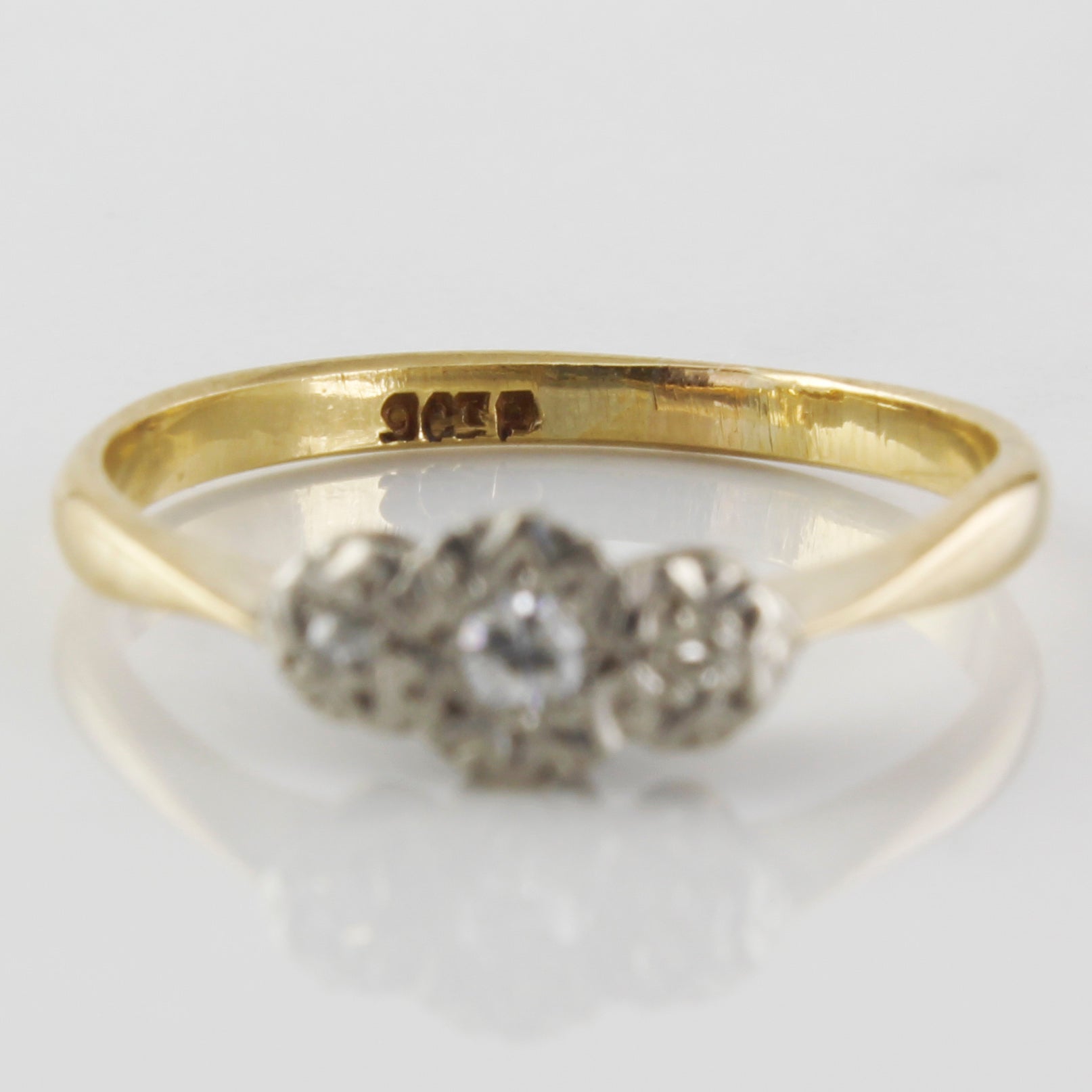 single cut diamonds in vintage ring with three stone set
